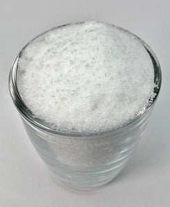 GLASS FULL OF OPTIMSM FLAKES